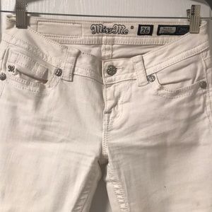 White “Miss Me” low rose skinny jeans